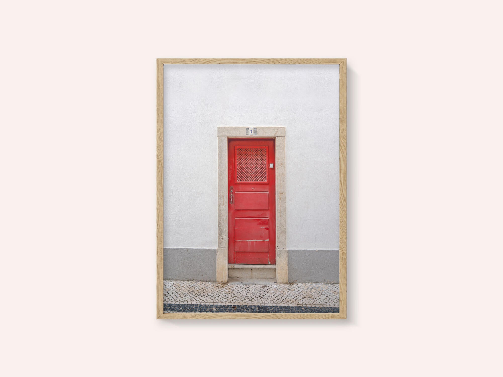 The red door nr 7 in Ericeira, Portugal - summer street and travel photography