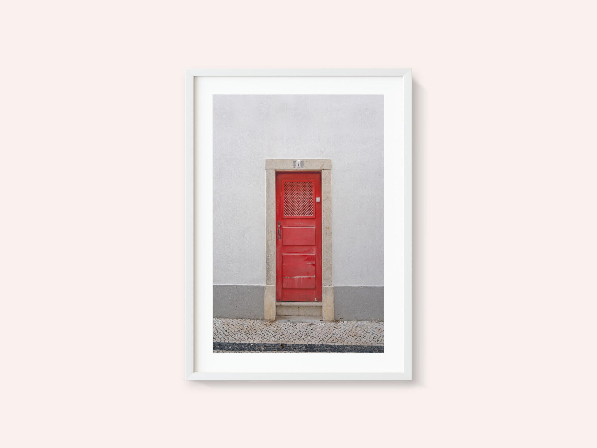 The red door nr 7 in Ericeira, Portugal - summer street and travel photography