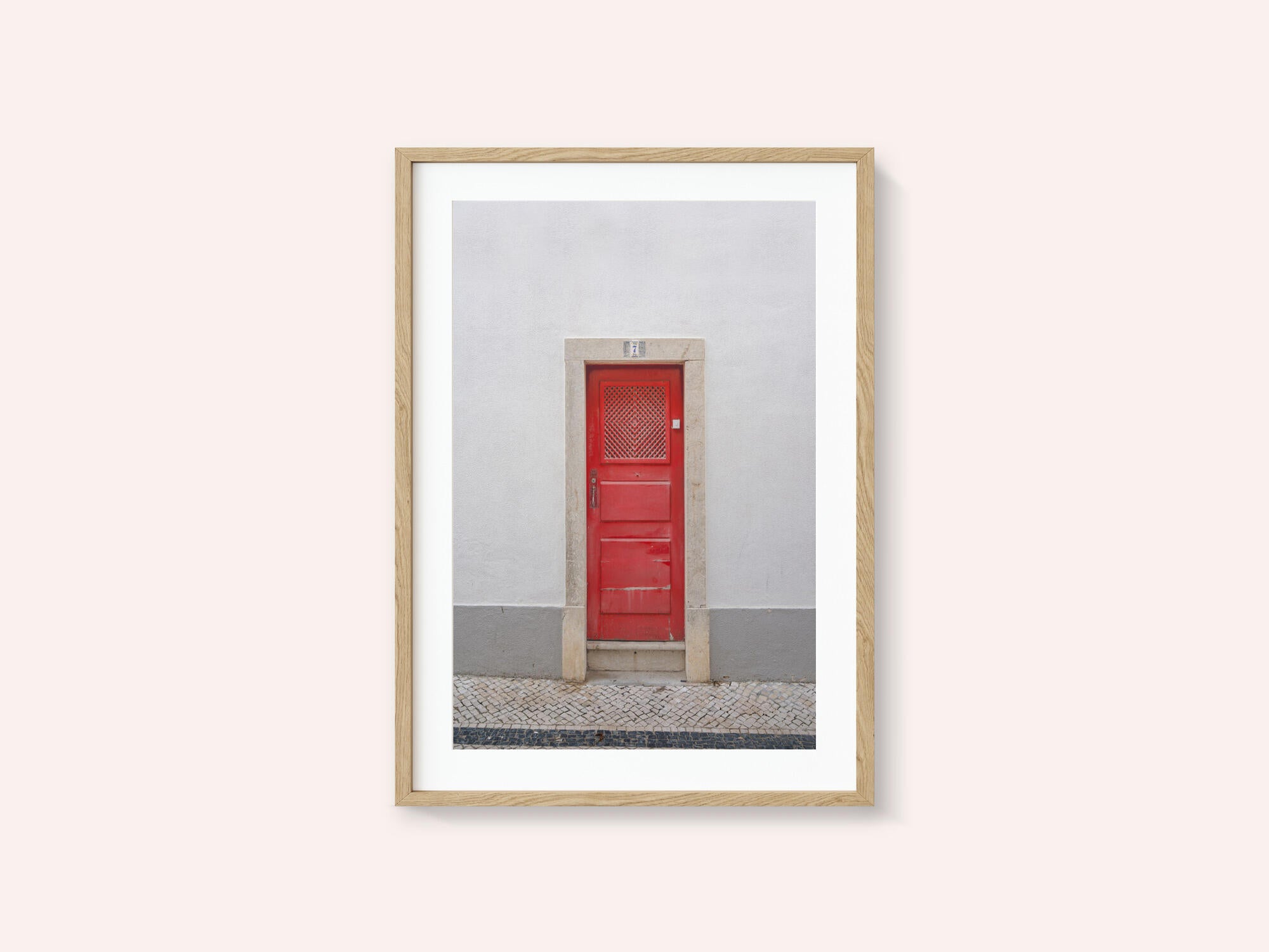 The red door nr 7 in Ericeira, Portugal - summer street and travel photography