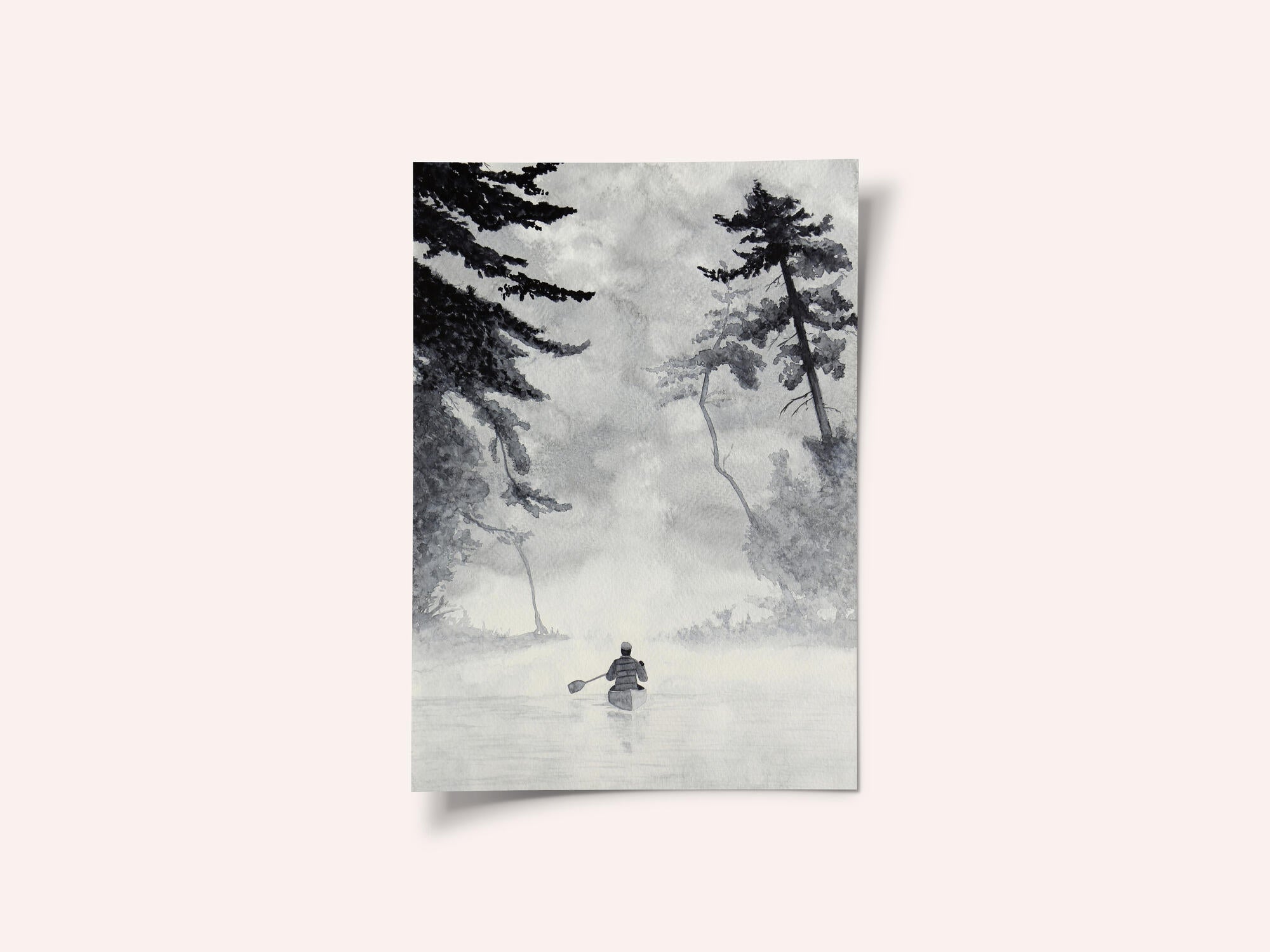 Man In a Canoe On Misty Water In a Forest Landscape