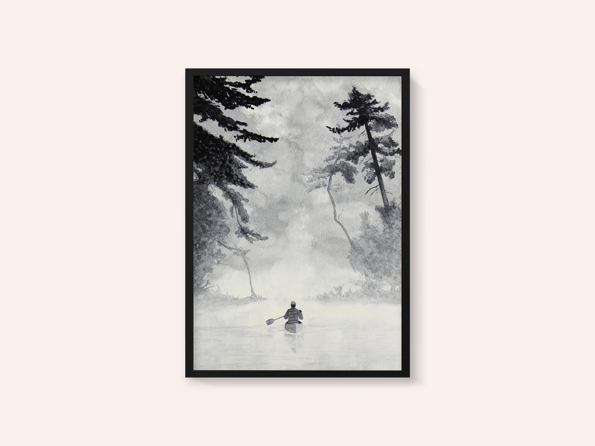 Man In a Canoe On Misty Water In a Forest Landscape