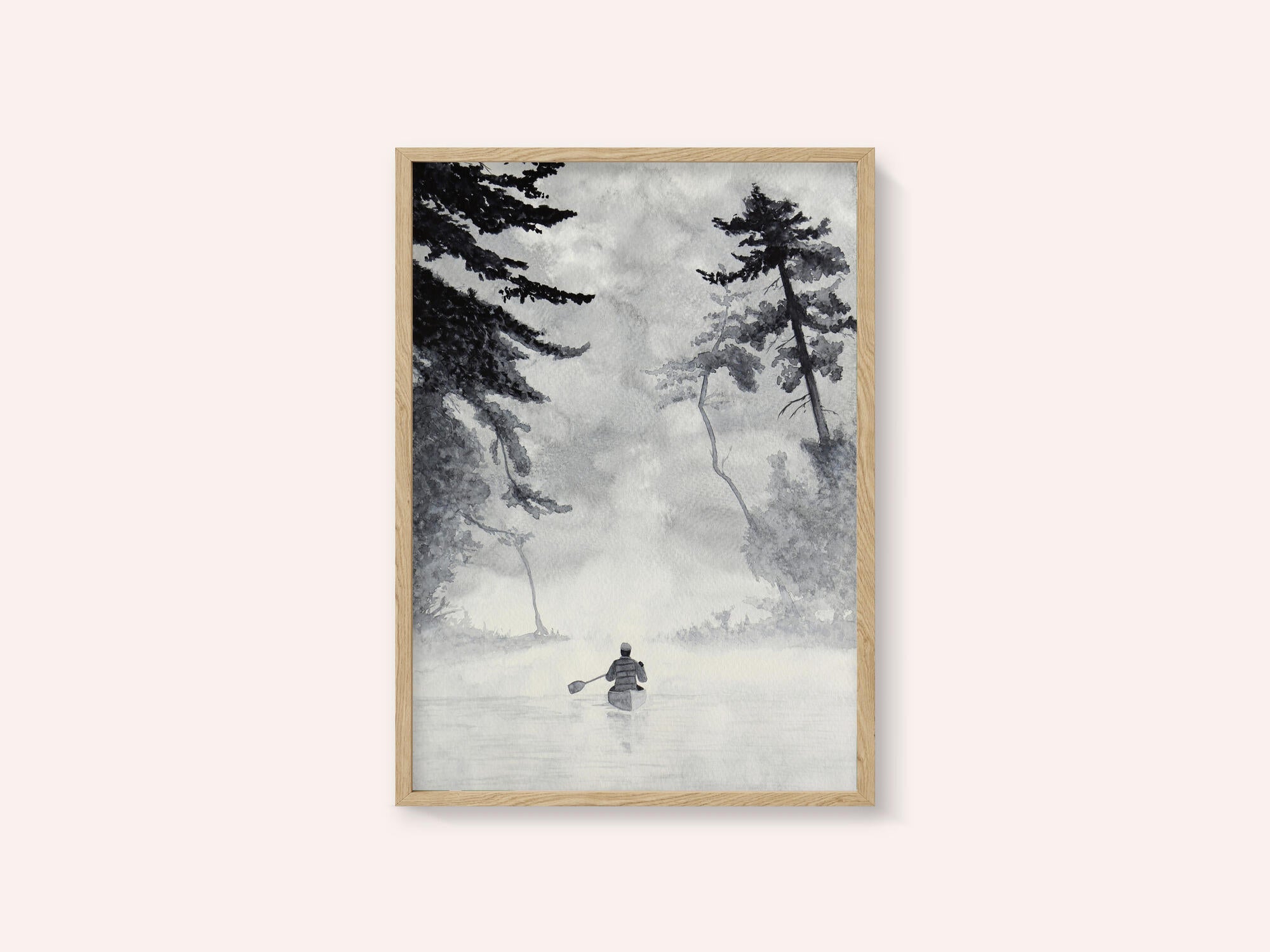 Man In a Canoe On Misty Water In a Forest Landscape