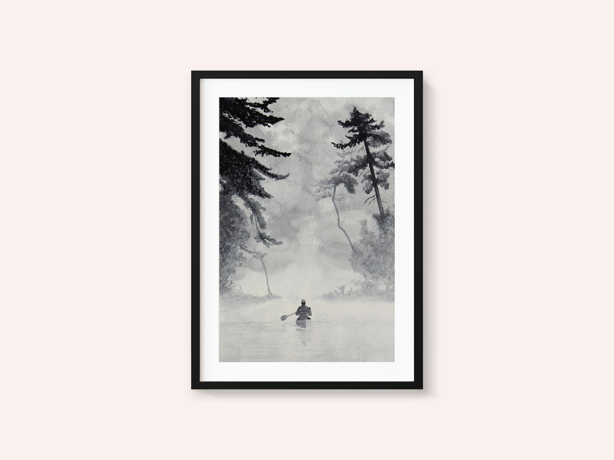 Man In a Canoe On Misty Water In a Forest Landscape