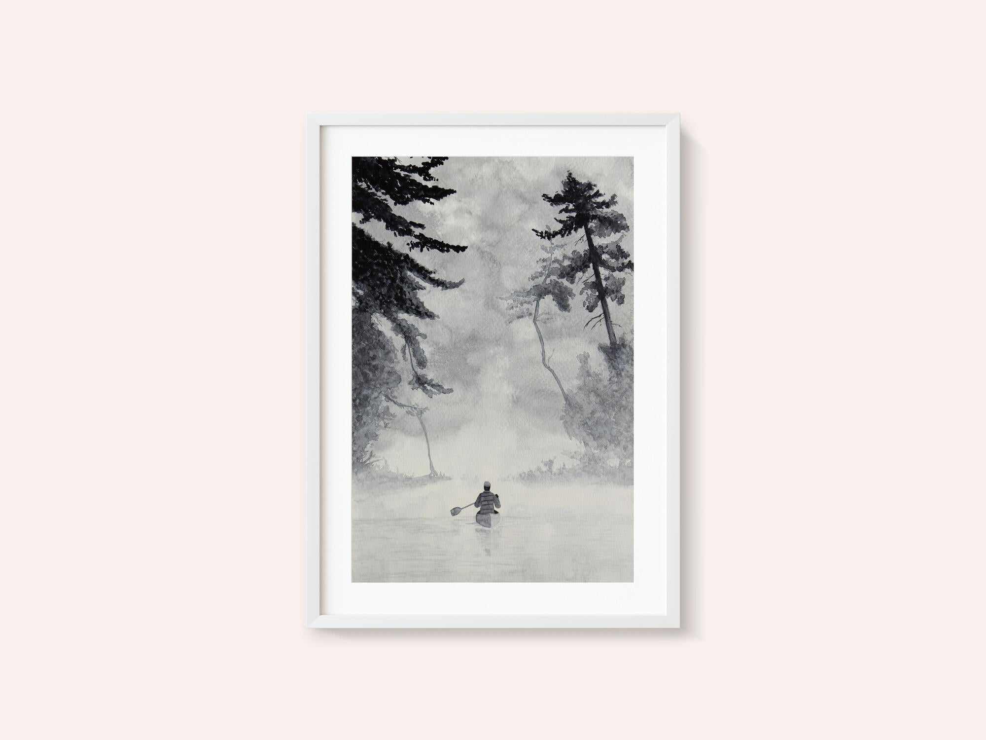 Man In a Canoe On Misty Water In a Forest Landscape