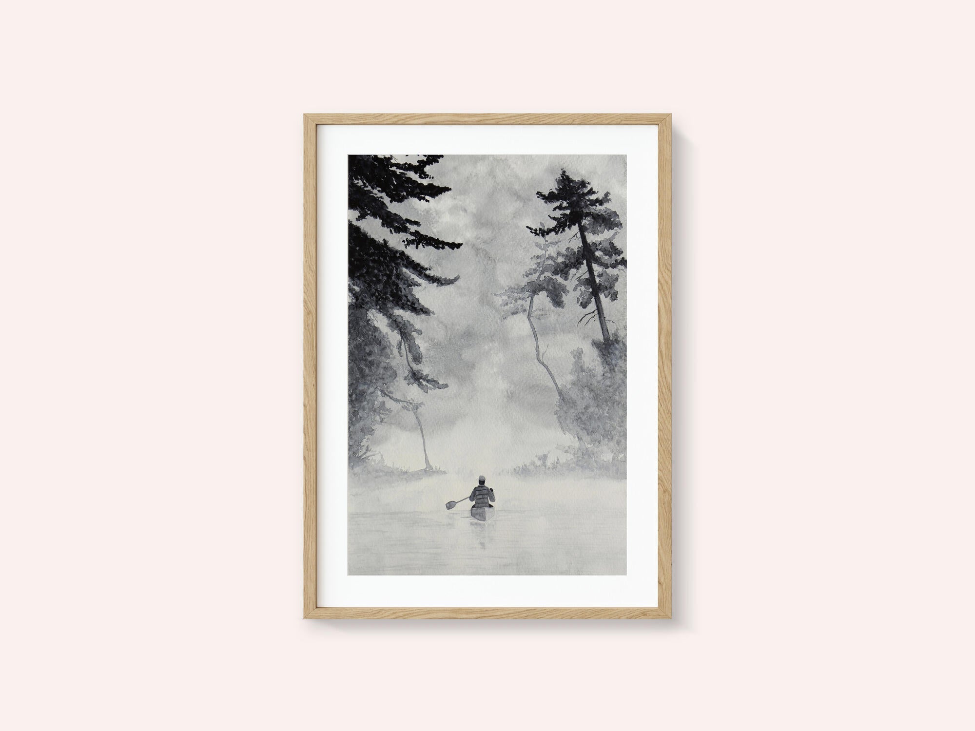 Man In a Canoe On Misty Water In a Forest Landscape