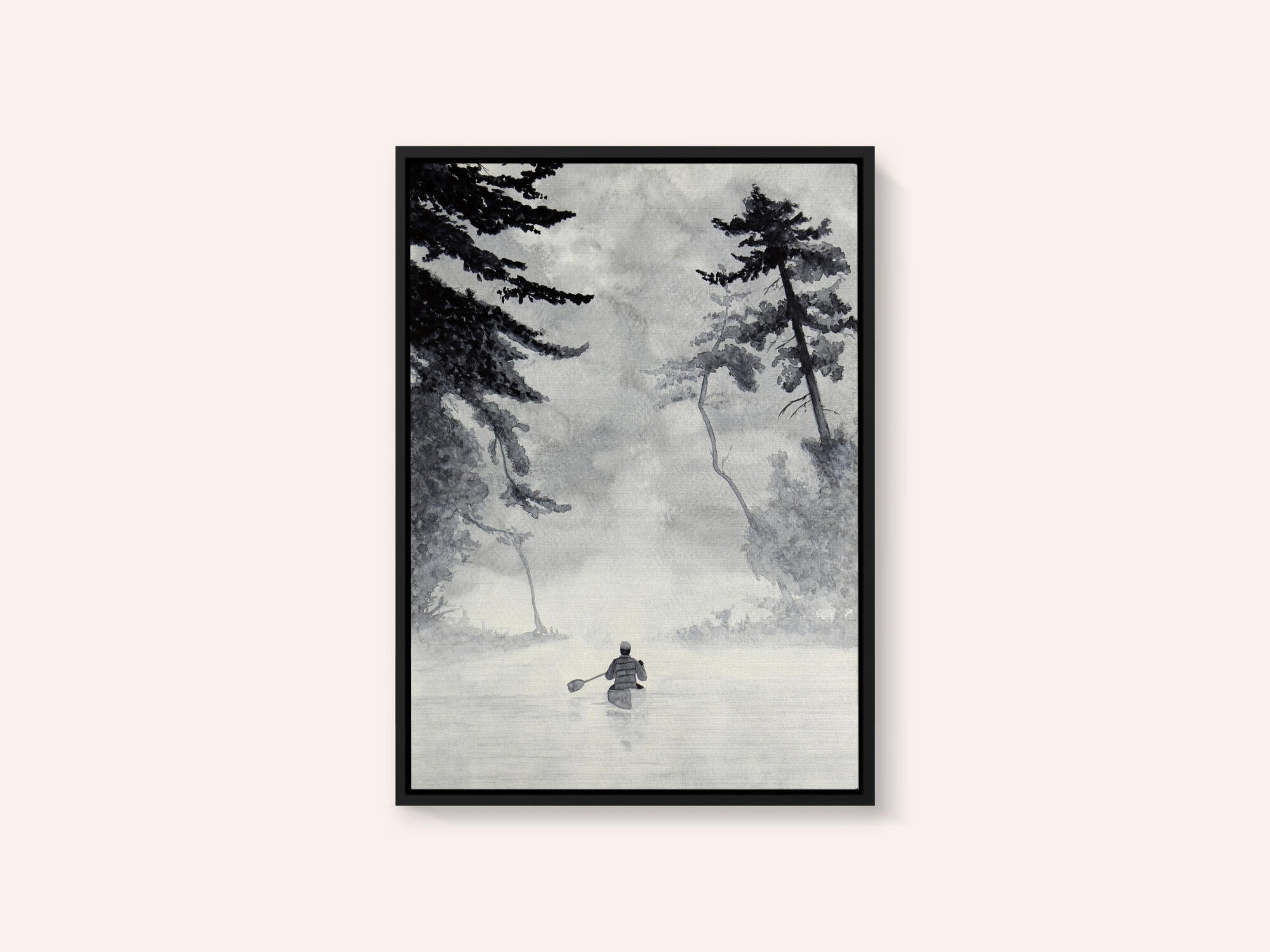 Man In a Canoe On Misty Water In a Forest Landscape