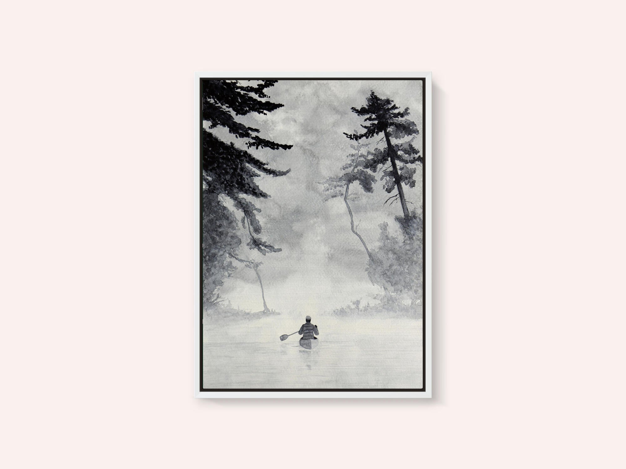 Man In a Canoe On Misty Water In a Forest Landscape