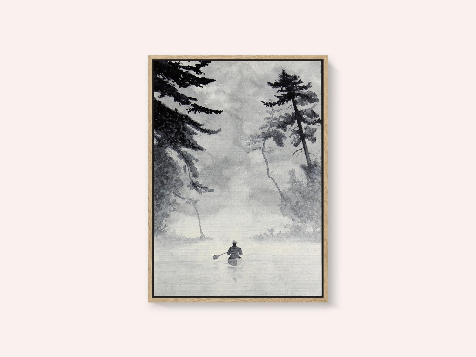 Man In a Canoe On Misty Water In a Forest Landscape