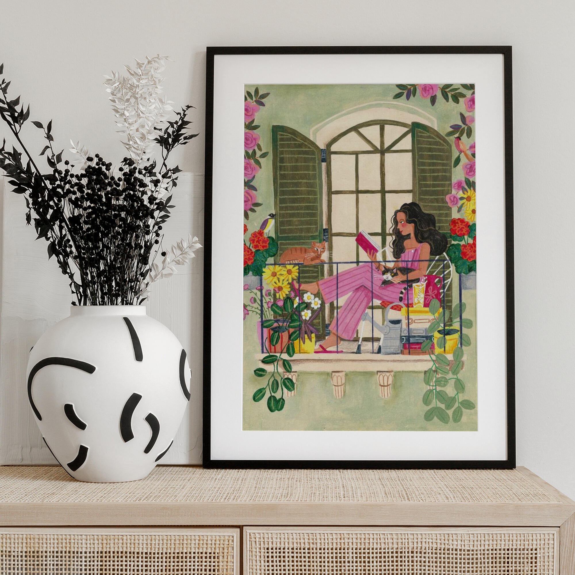 Woman reads on balcony