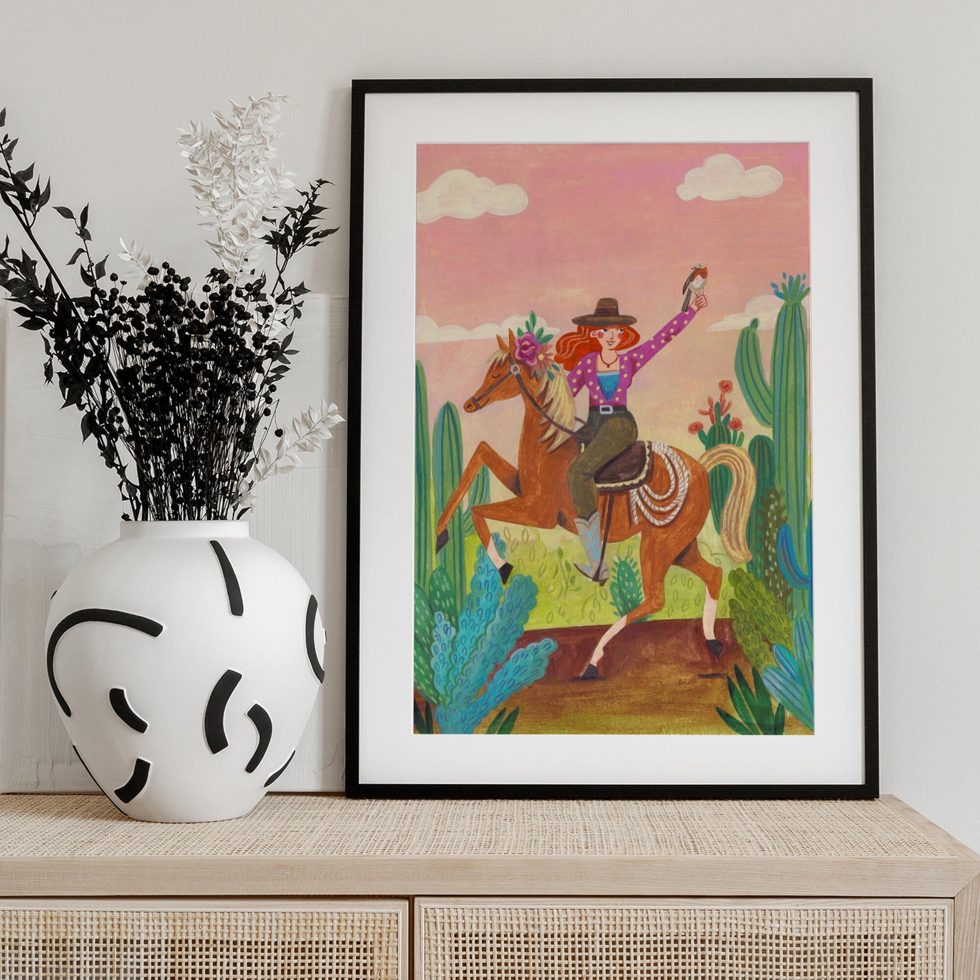 Cowgirl on horse in the desert