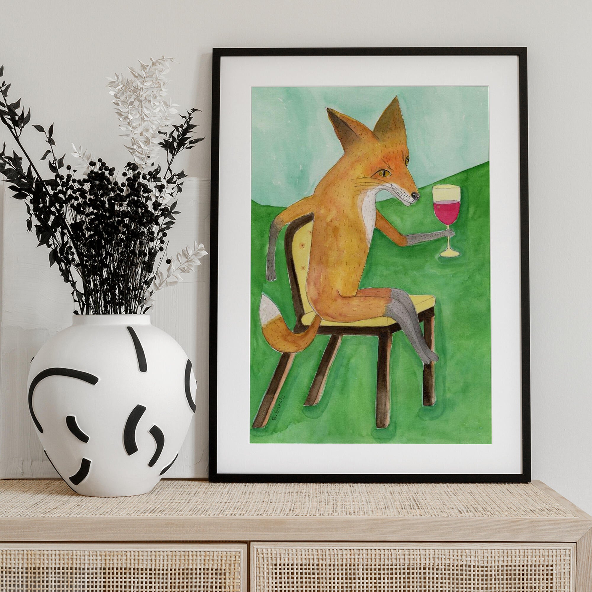 Mr. Fox drinking red wine