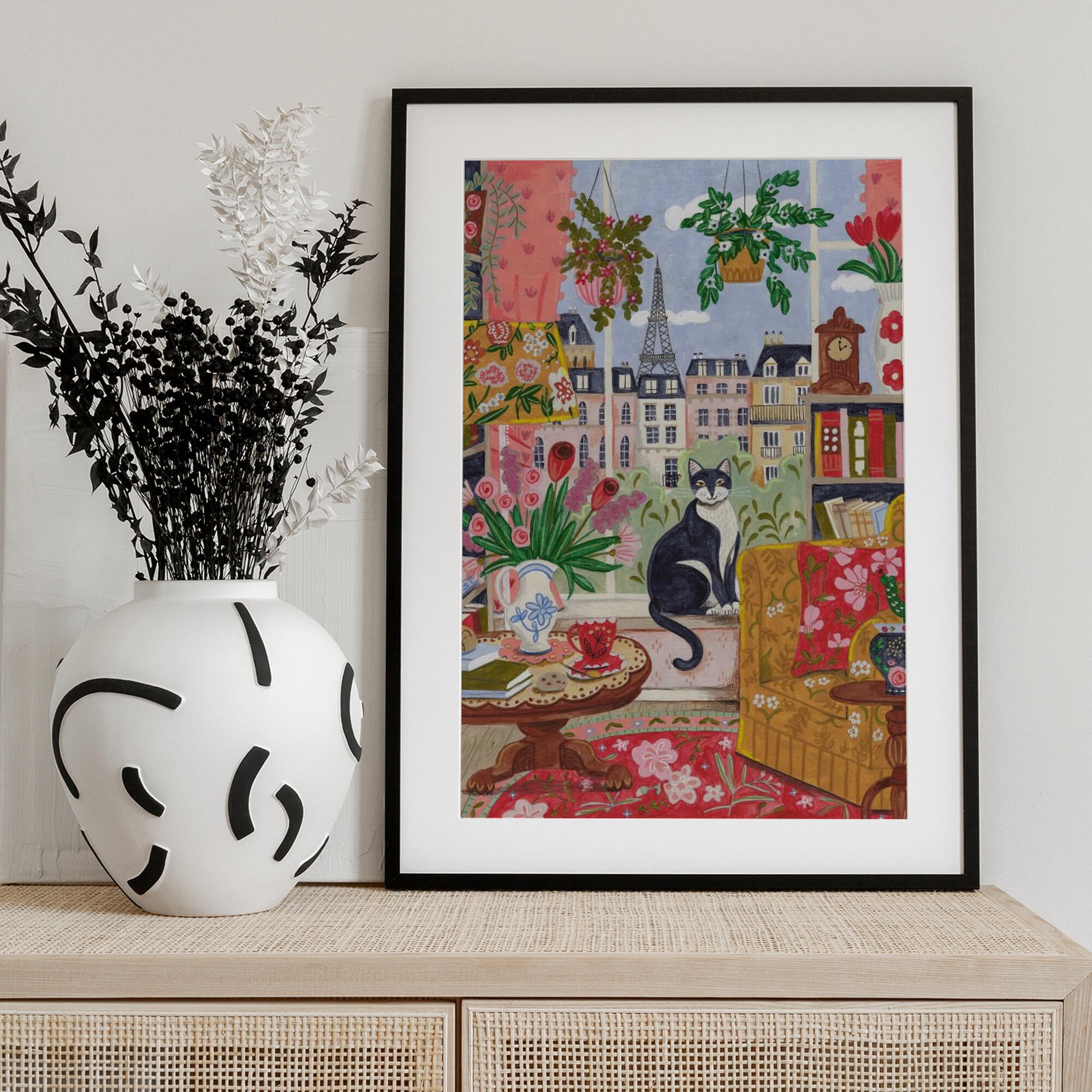 Cat in front of window in Paris bright colours