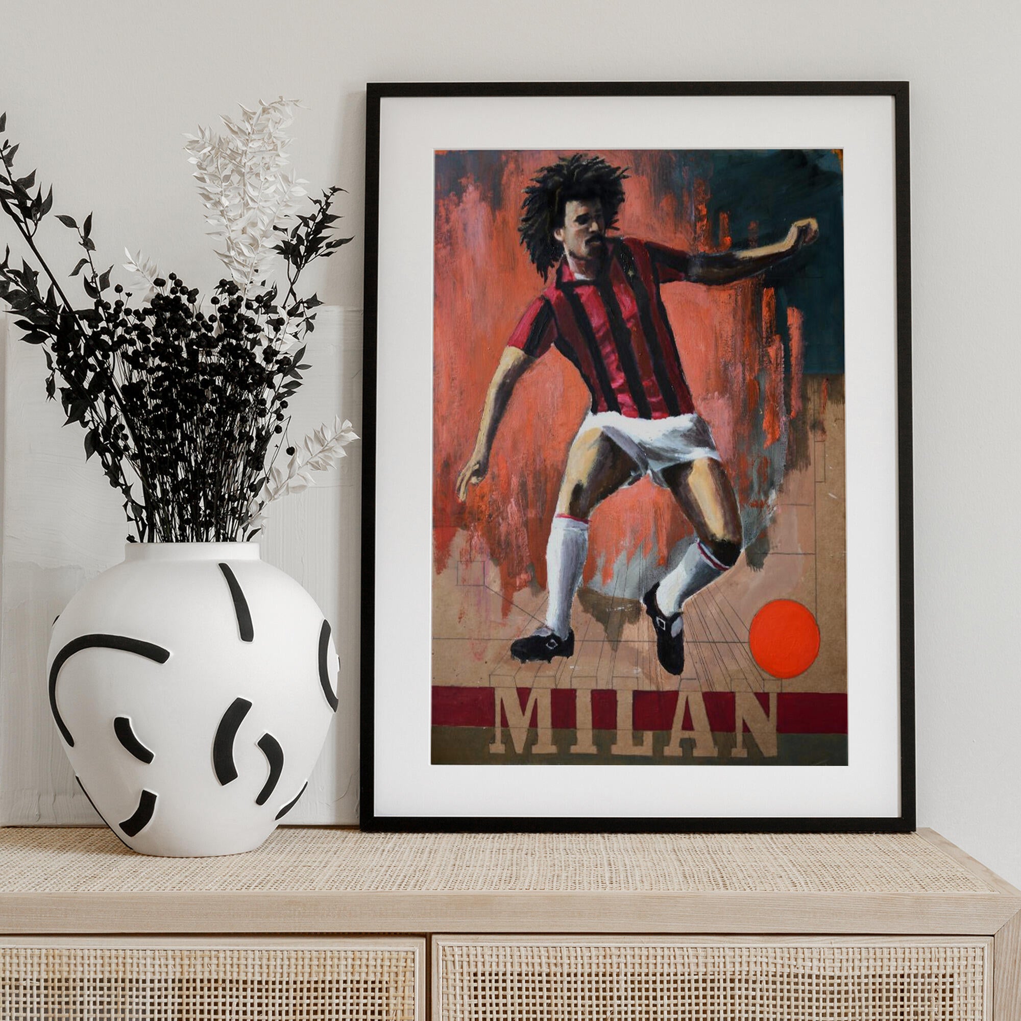 Dynamic Footballer in Red Stripes