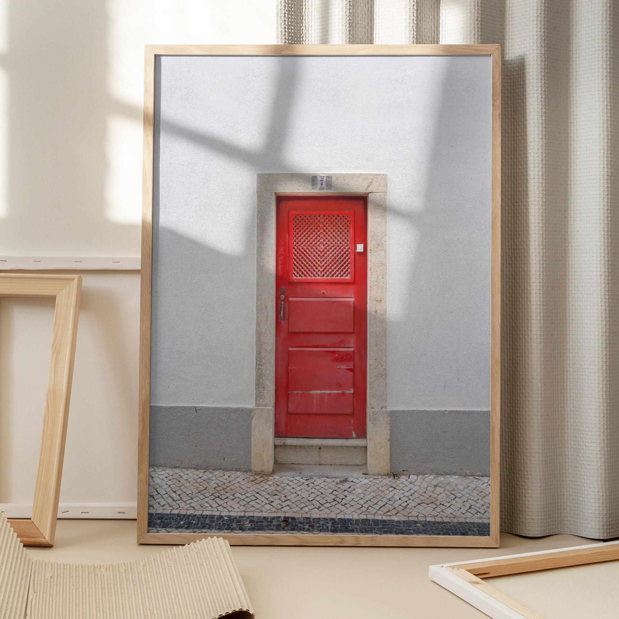 The red door nr 7 in Ericeira, Portugal - summer street and travel photography