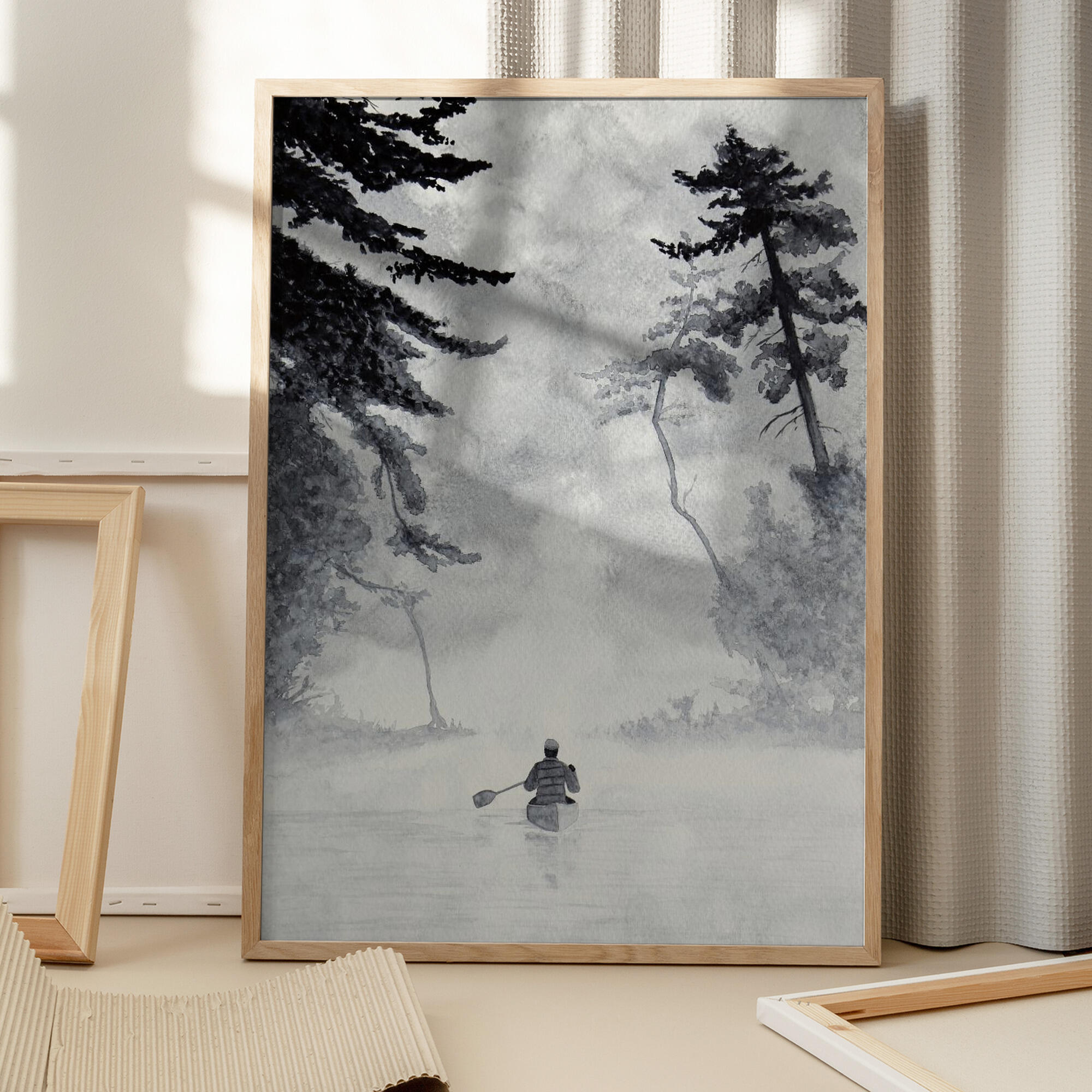 Man In a Canoe On Misty Water In a Forest Landscape