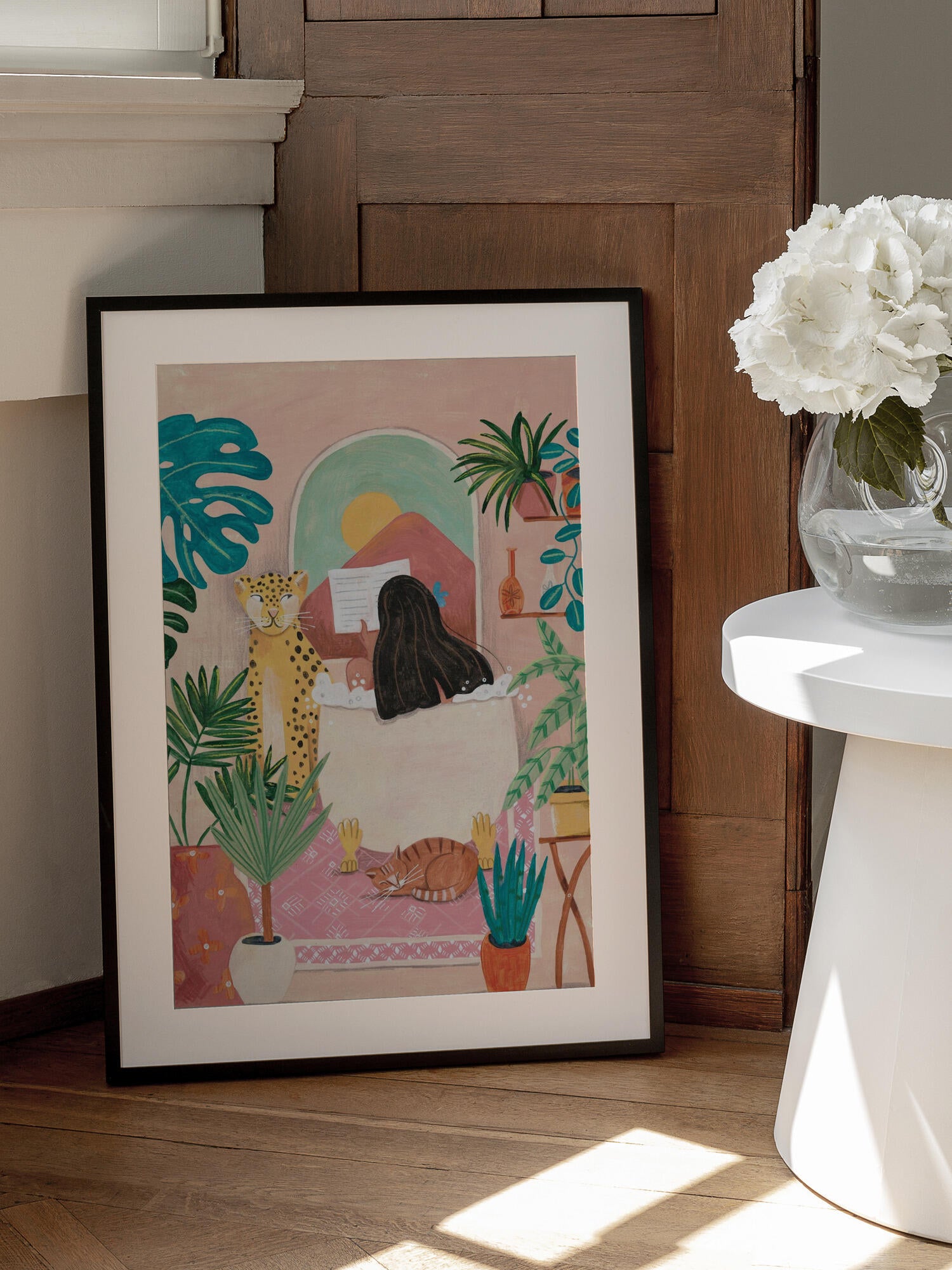 Woman taking bath in pink tropical bathroom