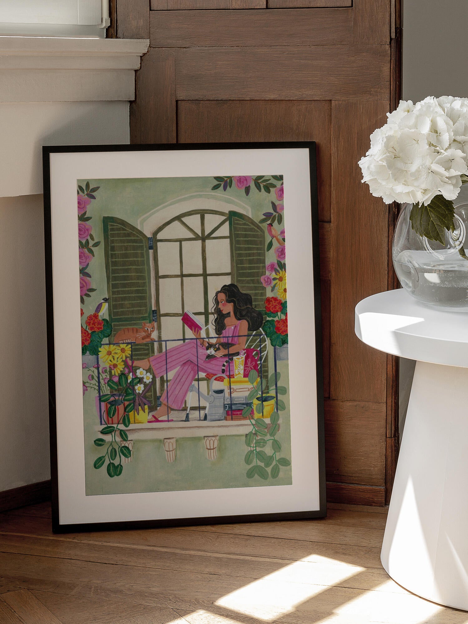 Woman reads on balcony