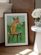 Mr. Fox drinking red wine