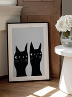 Two black cats