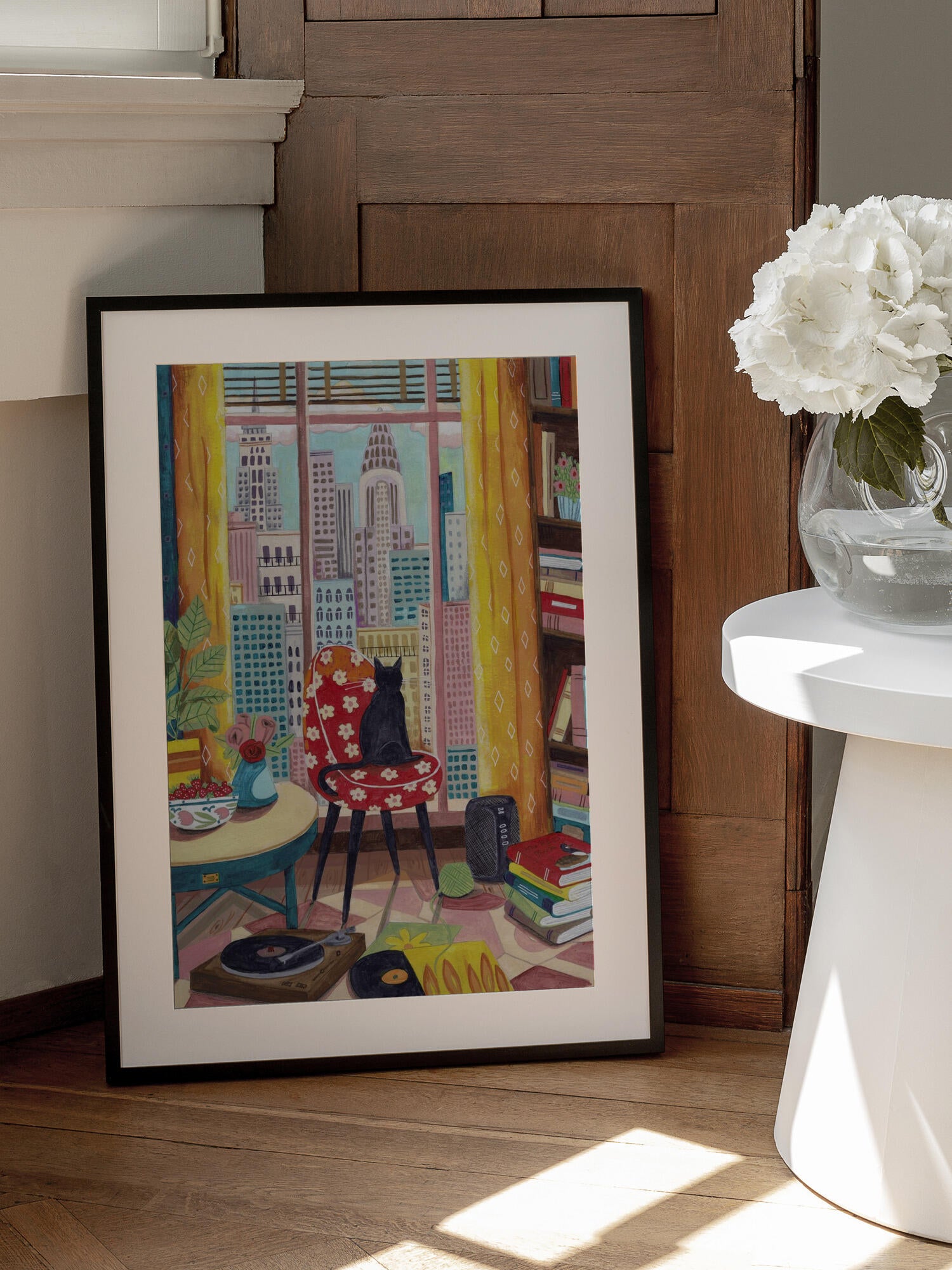 Cat in front of window in New York bright colours
