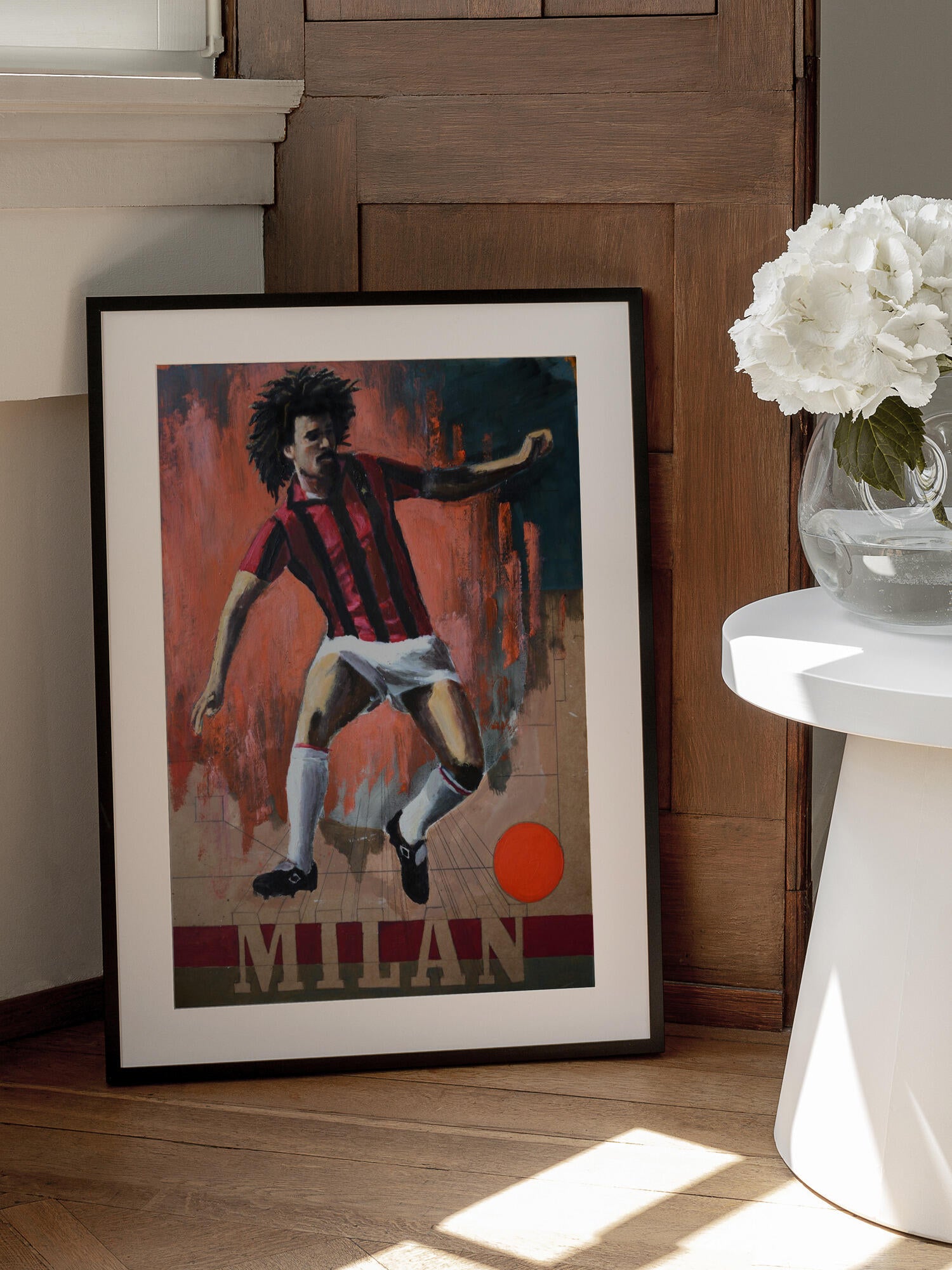 Dynamic Footballer in Red Stripes