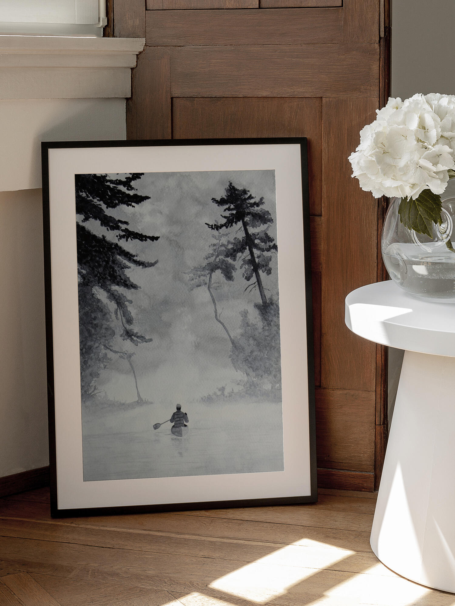 Man In a Canoe On Misty Water In a Forest Landscape